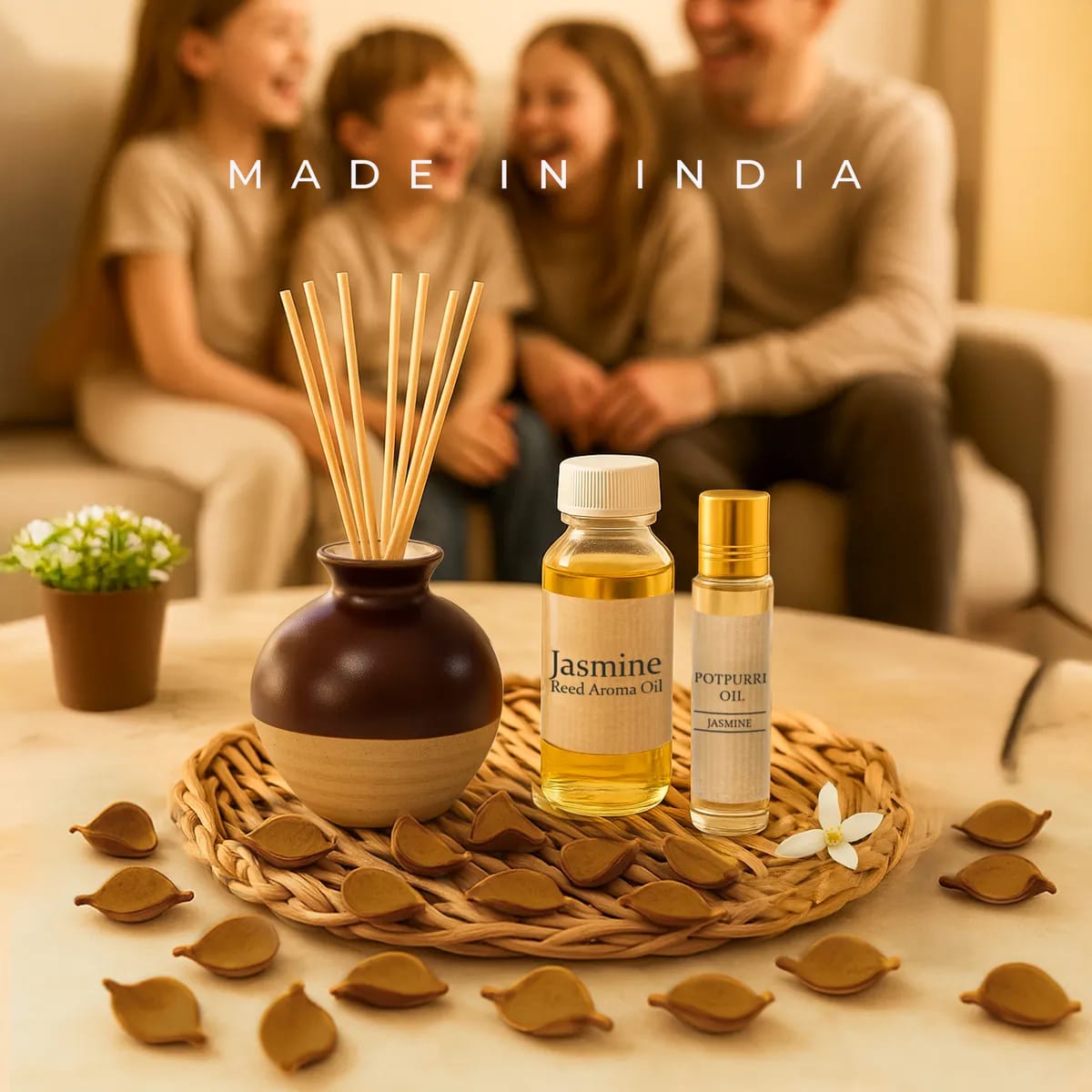 Aromatherapy diffuser and oils on a table with a family in the background, featuring 'Made in India' text.